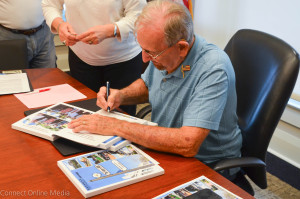Jerry Beverland autographs a copy of his newest book, Oldsmar: Past, Present and Future, on Saturday, Oct. 10.