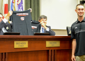 Oldsmar Christian head coach Jordan Fair presented team tee-shirts to the City Council in early November.