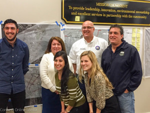 Oldsmar Mayor Doug Bevis poses with his team in front of their downtown design concept plan, nicknamed "The Edge".