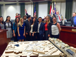The USF students pose with, and get photobombed by, Oldsmar City Council members following their presentations on Tuesday night.