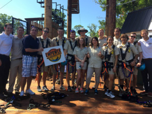 The Empower Adventures crew pose with Oldsmar Mayor Doug Bevis during the opening ceremony for the city's new zipline aerial adventure park.