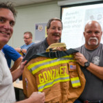 Oldsmar Mayor Doug Bevis (L) and Fire Chief Dean O'Nale (r) flank retiring Lt. Aaron Gonzalez on Friday.