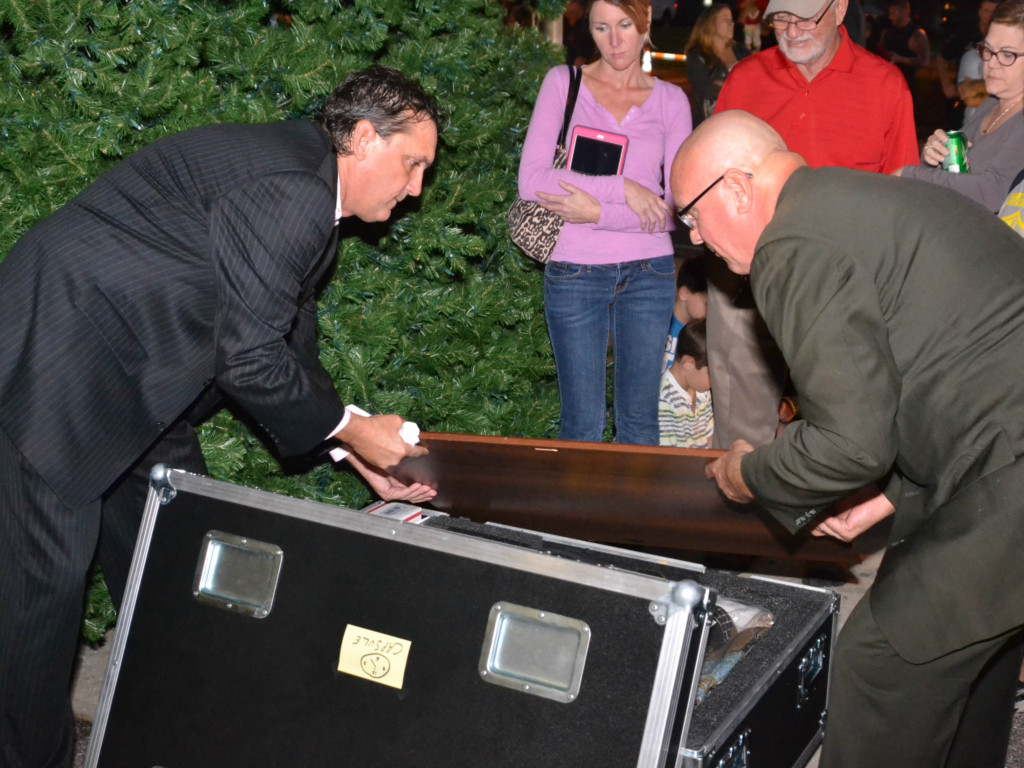 Oldsmar Doug Bevis (r) and City Council member Dan Saracki close the city's time capsule during a ceremony on Tuesday, Dec. 6, 2016.