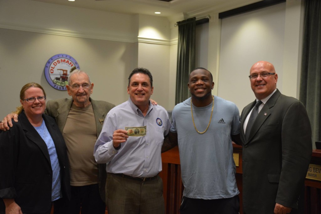 Former Oldsmar Falcon and East Lake High star Artavis Scott poses with Oldsmar officials (l-r) City Clerk Ann Nixon, Council Member Jerry Beverland, Mayor Doiug Bevis and City Council Member Dan Saracki on January 17, 2017.