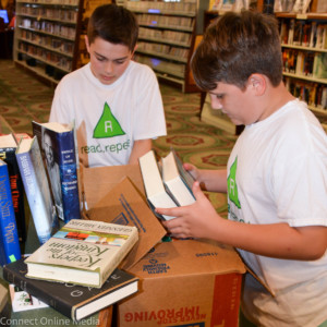 Chase Hartman (l) and vance Tomasi delivered 300 books to the Oldsmar Public Library on Tuesday, Feb. 15, 2017.