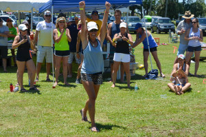 Holly Jones celebrates winning her division at the Paddle For Kids event.