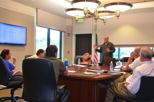 SEB President Stephen Grimme speaks to Oldsmar city officials about the Market Square project.
