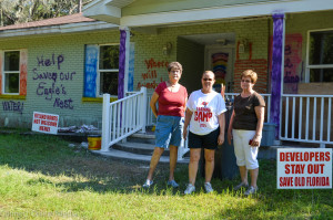 Oldsmar resident Babe Wright (L) and neighbors Mary Weiss and Rose Ann Parsons pose in front of a home near the proposed Oldsmar Trace development site.