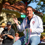 Oldsmar Mayor Doug Bevis atop his parade vehicle on Saturday.