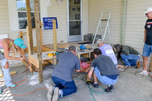 Oldsmar residents work on the deck at the home of Kaye and Larry Wolfe.