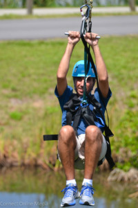 Drew Graef comes in for a landing on one of the five zipline runs at Oldsmar's new aerial adventure park.