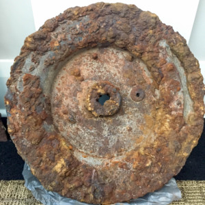 The flywheel from an original Oldsmobile tractor cast at a foundry on Tampa Road by Ransom E. Olds around 1920 was recently found in the driveway of a downtown Oldsmar resident.