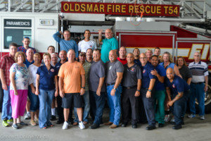 Aaron Gonzalez poses with former Oldsmar Fire Rescue coworkers on the day of his retirement.