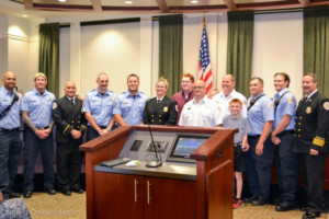 Members of the Oldsmar Fire Rescue department, including Chief Dean O'Nale (far right) and their families pose following a swearing-in ceremony in the Oldsmar Council Chambers on Tuesday, November 1, 2016.