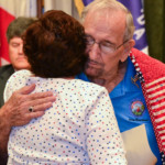 Jerry Beverland hugs Ginger Messer after receiving his Quilt of Valor on Dec. 6, 2016.